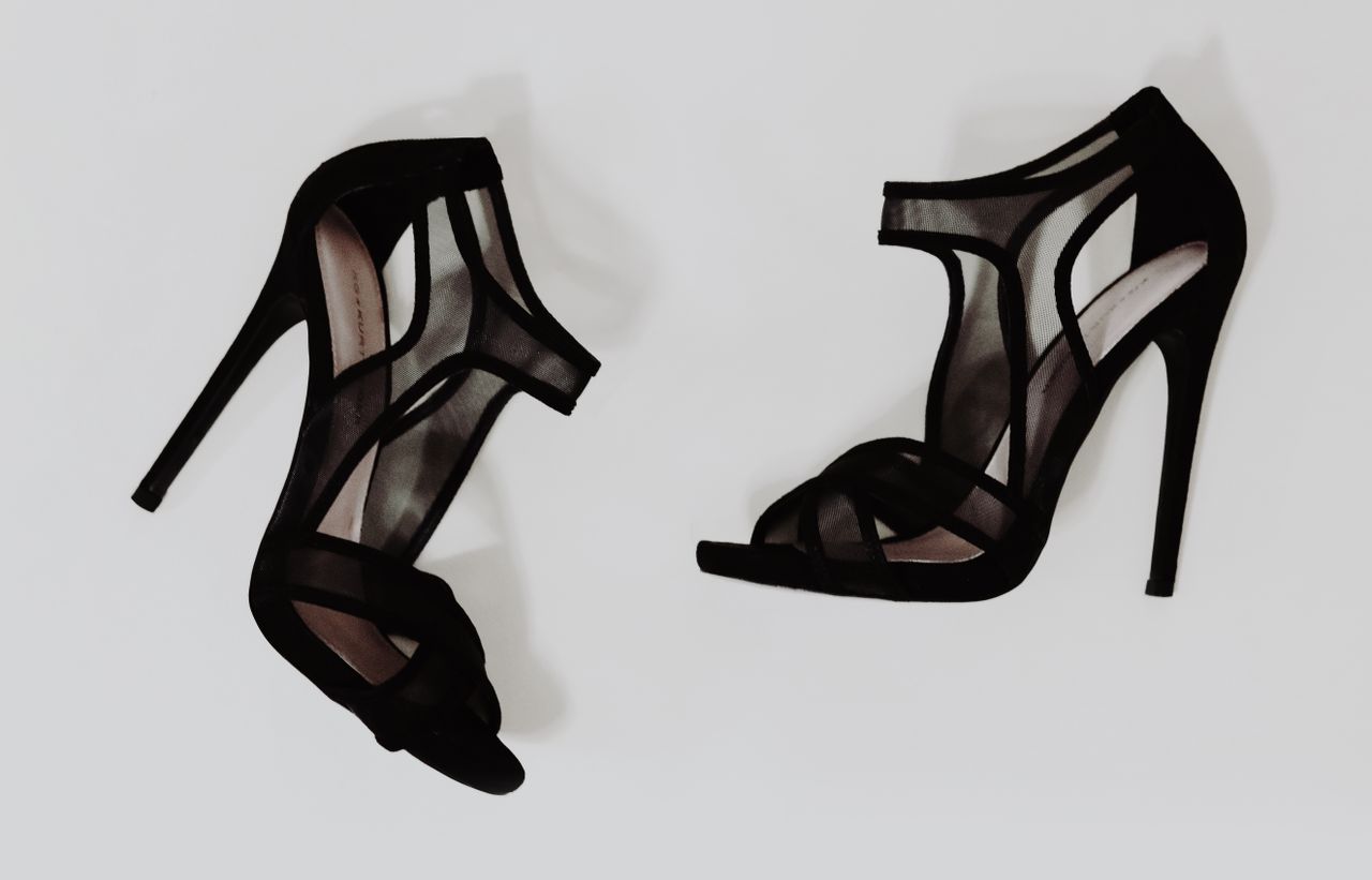 The Art of Drawing Readers In: Your attractive post title goes here Stylish black high heel sandals with mesh design, ideal for fashion and footwear imagery.